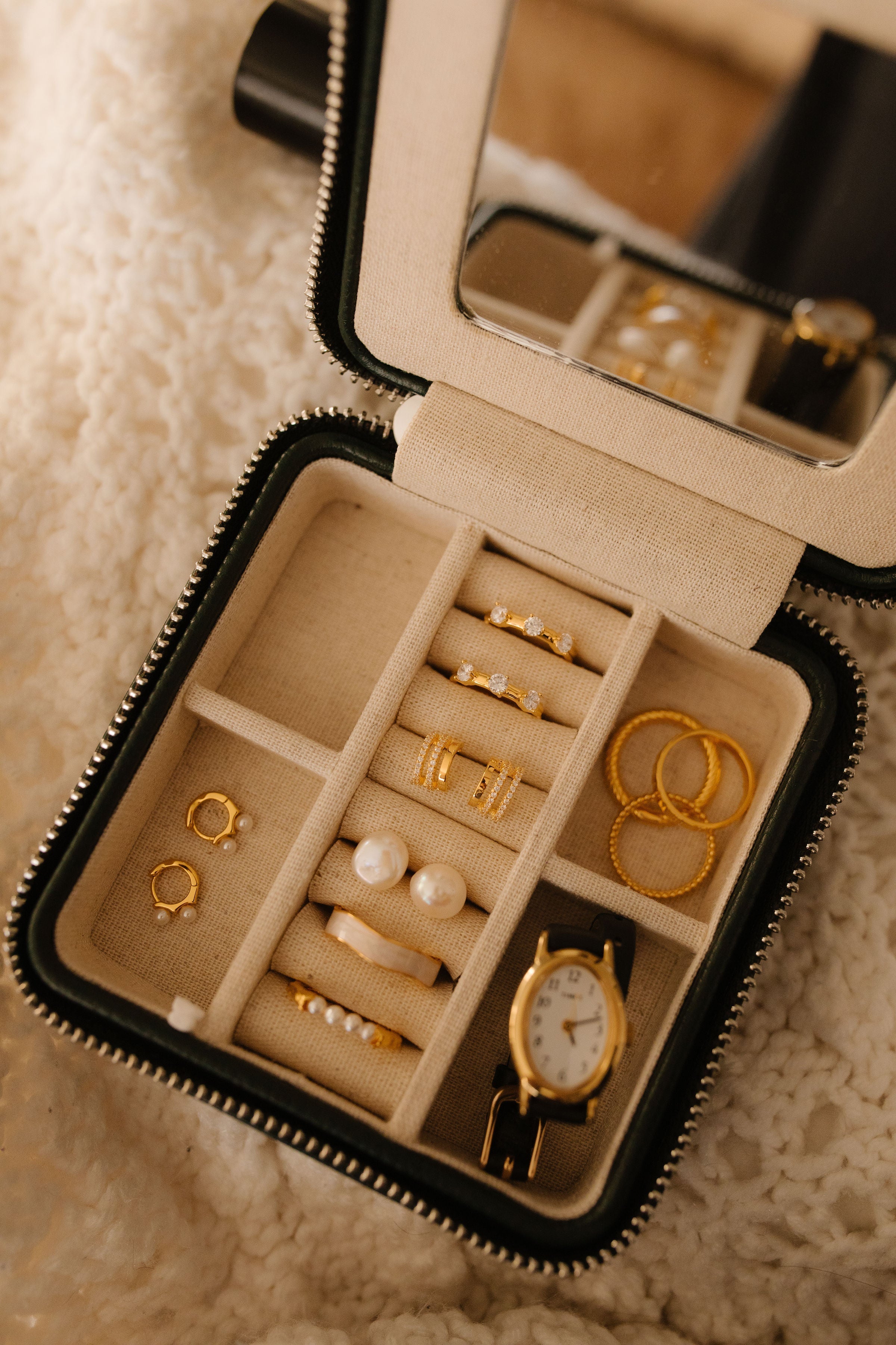 Jewlery case with 18k Gold Vermeil and pearl earrings and sleek gold and pearl rings from Pink Cove.